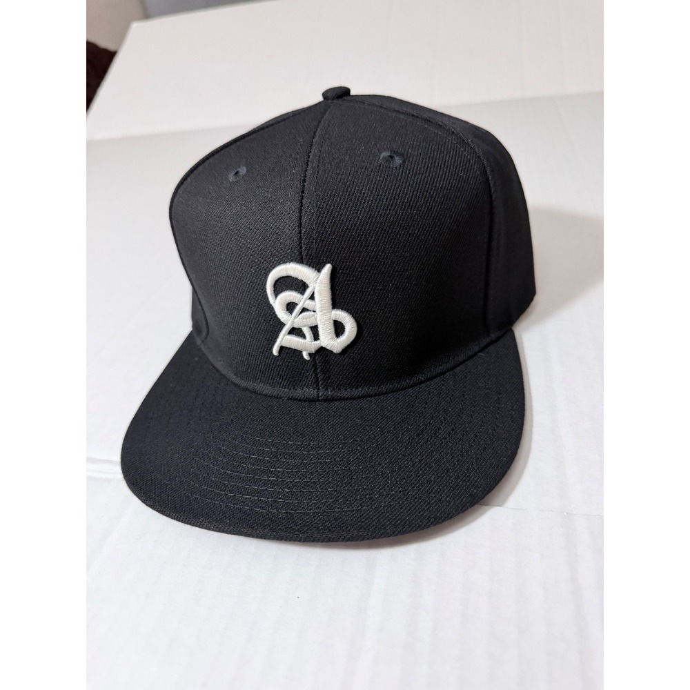 Ananke Black Snapback Hat White Embroidered Logo Gothic Script Flat Brim Cap
